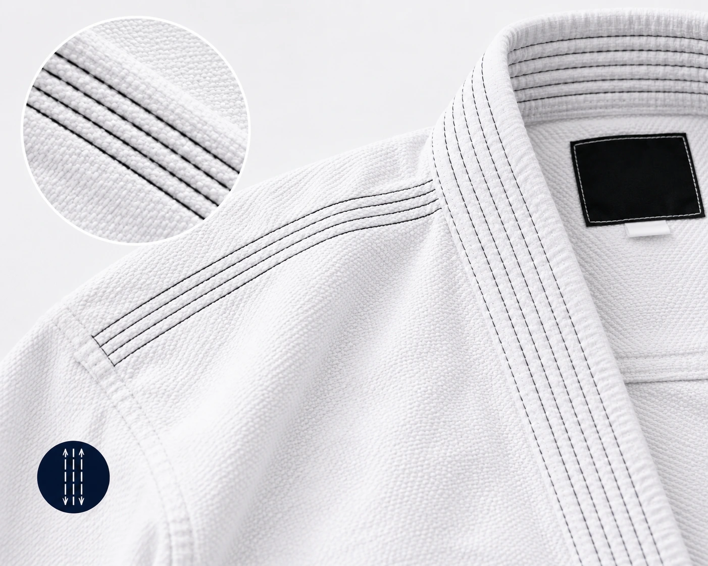 Close-up of triple-stitched seams on a white BJJ gi
