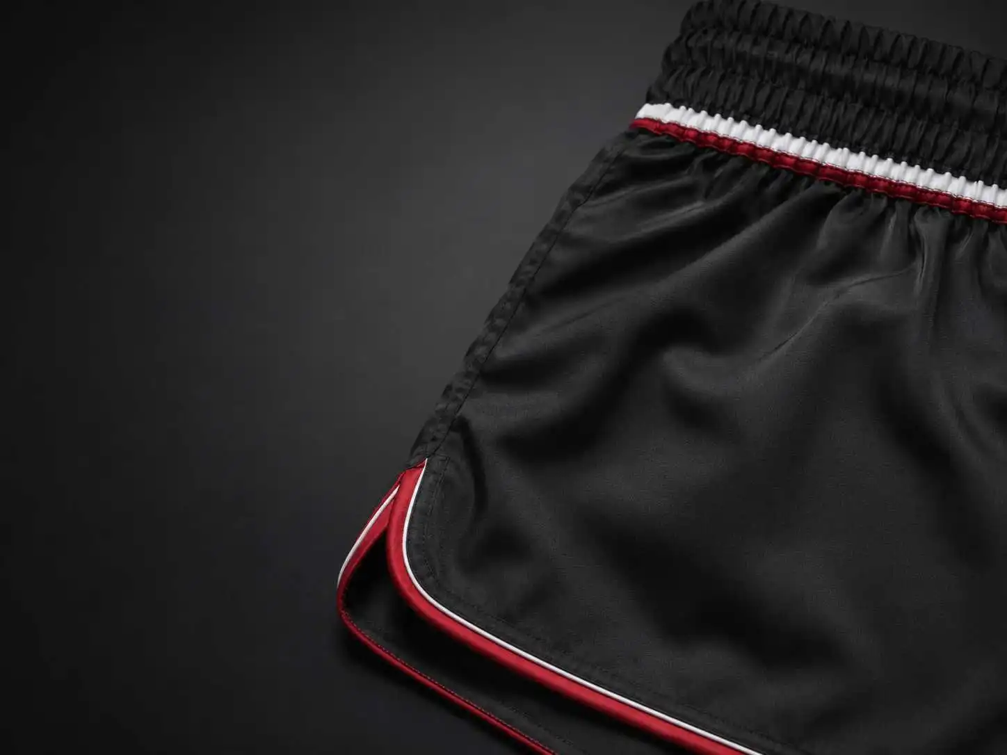 black athletic shorts with red trim