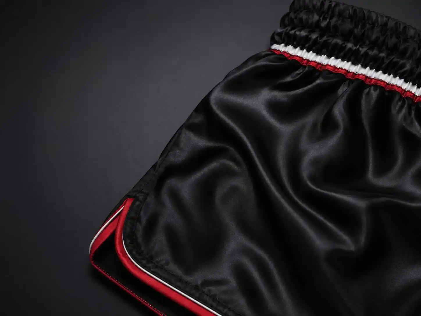 black satin athletic shorts close up