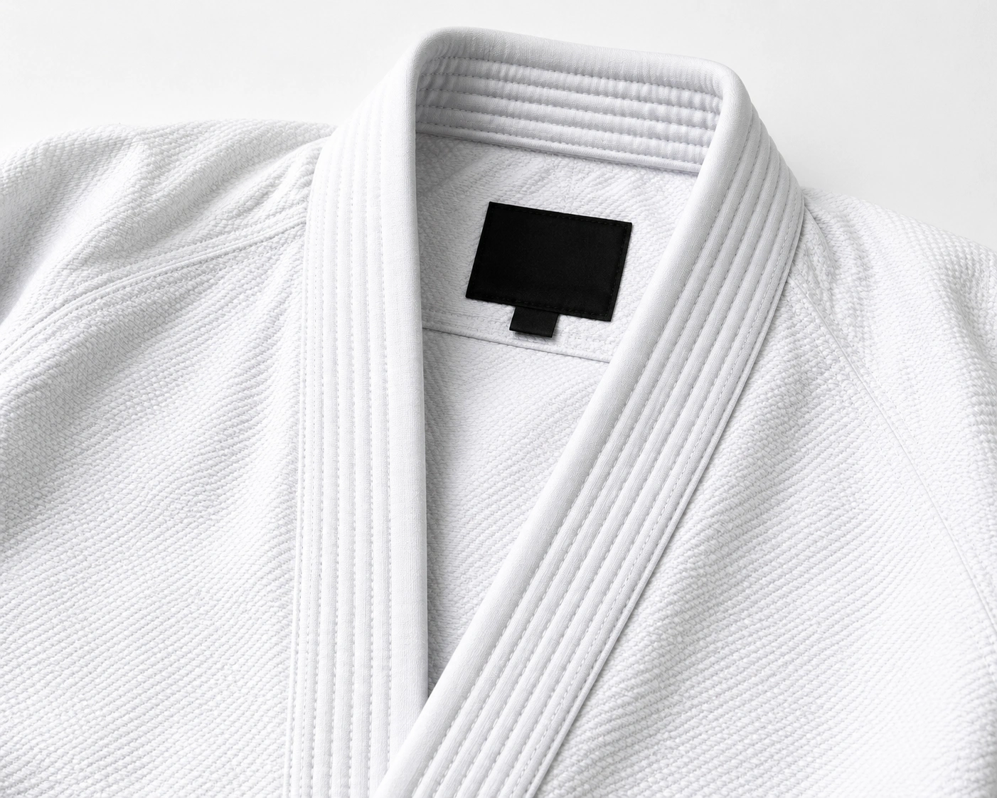 Reinforced collar close-up on a premium white BJJ gi