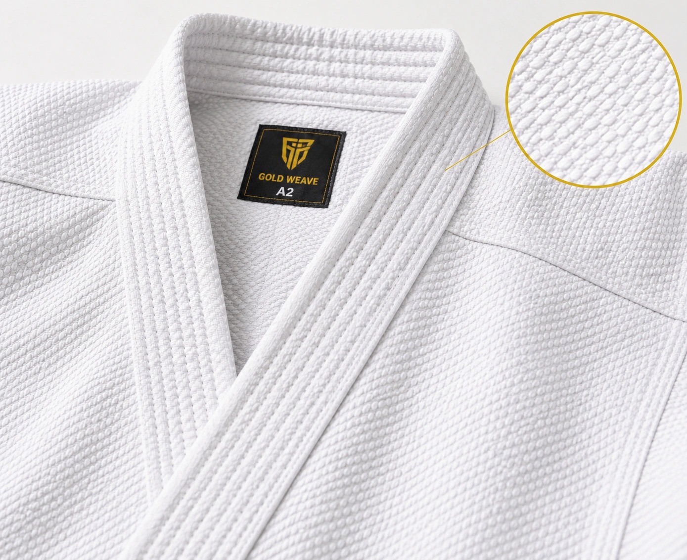Close-up of white gold weave karate gi fabric with reinforced collar