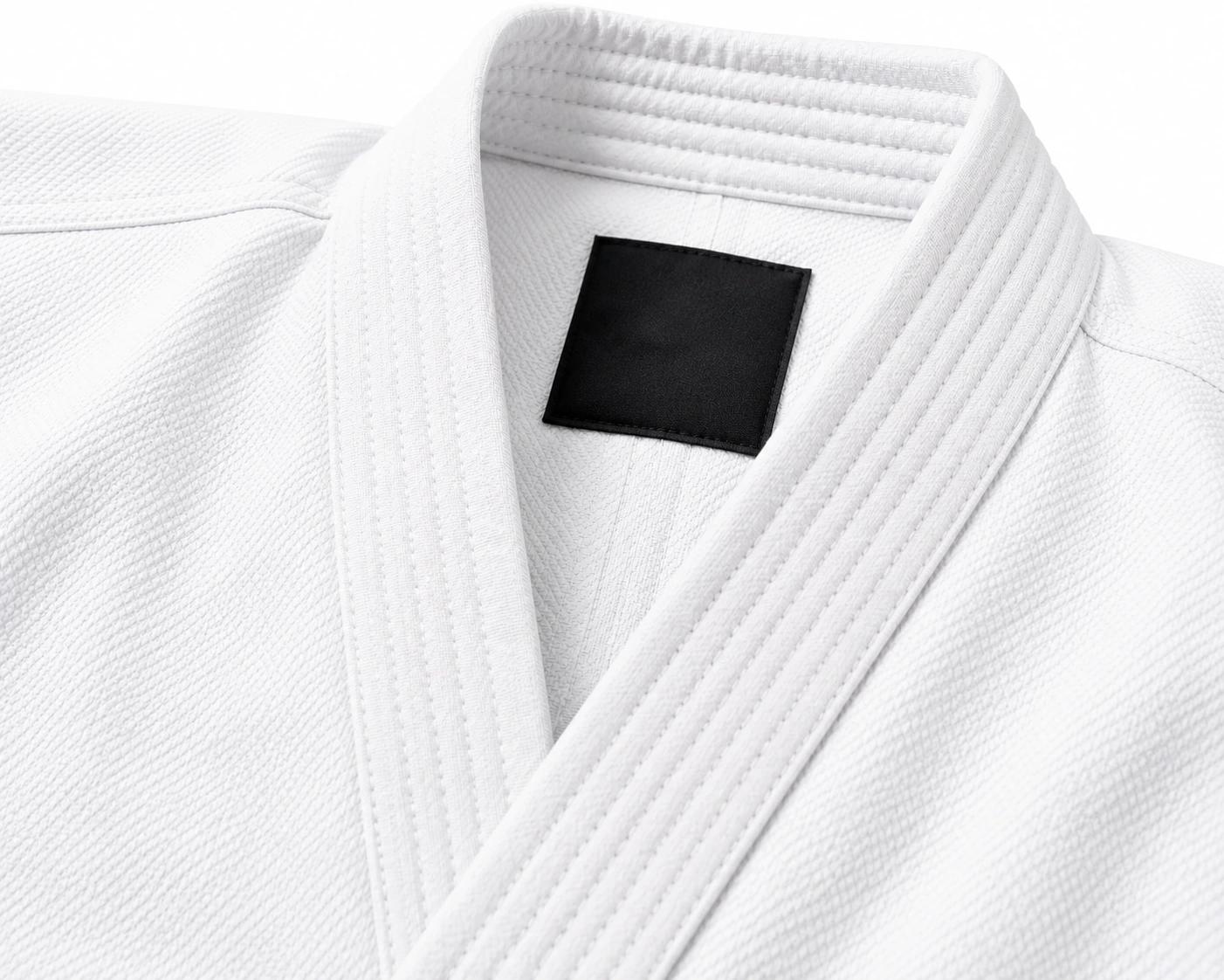 Reinforced white karate gi collar with a custom black neck label